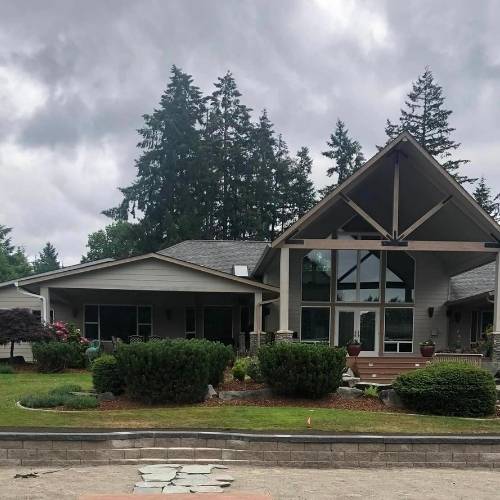 Concrete patio and retaining wall installed by hardscaping company in Kansas City